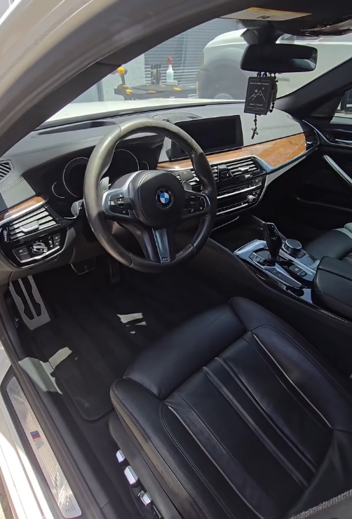 Cleaned BMW interior with steering wheel, dashboard and leather seats